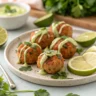 baked salmon meatballs with avocado sauce on plate