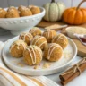 Pumpkin cheesecake balls coated in graham crumbs and white chocolate