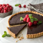 Rich Chocolate Ganache Tart 9 Chocolate ganache tart topped with raspberries and mint