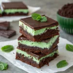 Mint Chocolate Brownies – Fudgy, Refreshing, and Irresistible 9 Stack of chocolate mint brownies with mint frosting
