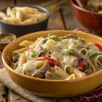 Bowl of creamy Philly Cheesesteak Pasta with beef and peppers