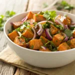 Bowl of fresh Sweet Potato Salad with herbs