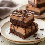 Chocolate Mousse Brownies with rich mousse topping on a plate