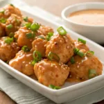 Crispy Bang Bang Chicken Bites coated with spicy creamy sauce
