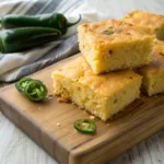 Golden jalapeño cheddar cornbread loaf with melted cheese