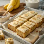 Banana Bread Brownies cut into squares with frosting