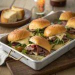 Roast Beef Sliders on a tray with melted cheese