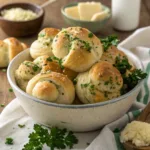 Sourdough discard garlic knots are soft, fluffy, and packed with rich garlic flavor. This recipe turns leftover sourdough discard into irresistible knots that work perfectly as a side dish, appetizer, or snack. Fresh from the oven, they deliver bakery-style texture with homemade comfort. Pinterest description: Soft sourdough discard garlic knots brushed with garlic butter. Easy side dish or appetizer using sourdough discard. Why You’ll Love This Recipe Uses sourdough discard with no waste Soft, fluffy texture with golden edges Rich garlic butter flavor Perfect as a side, snack, or appetizer Easy to prepare with simple ingredients Ingredients 1 cup sourdough discard 2 ½ cups all-purpose flour 1 tablespoon sugar 1 teaspoon salt 2 teaspoons instant yeast ¾ cup warm water 2 tablespoons olive oil Garlic Butter: 4 tablespoons unsalted butter, melted 3 cloves garlic, minced 1 tablespoon chopped parsley ¼ teaspoon salt Step-by-Step Instructions In a large bowl, combine sourdough discard, warm water, sugar, yeast, and olive oil. Add flour and salt, mixing until a soft dough forms. Knead dough for 5–7 minutes until smooth and elastic. Cover and let rise for 1 hour until doubled in size. Preheat oven to 400°F (200°C) and line a baking sheet. Divide dough into strips, tie each strip into a knot, and place on baking sheet. Bake 15–18 minutes until lightly golden. Mix melted butter, garlic, parsley, and salt. Brush garlic butter generously over warm knots before serving. Tips & Variations Add grated parmesan to garlic butter for extra flavor Use fresh herbs like basil or oregano Shape into rolls instead of knots if preferred Brush with garlic butter twice for stronger flavor Storage & Freezer Instructions Store leftovers in an airtight container for up to 3 days Reheat in the oven at 350°F (175°C) for best texture Freeze baked garlic knots for up to 2 months Thaw at room temperature before reheating Serving & Pairing Ideas Serve alongside pasta dishes Pair with soups or stews Enjoy with marinara sauce for dipping Add to appetizer platters Frequently Asked Questions Can I use unfed sourdough discard? Yes, unfed discard works perfectly and adds mild tang without overpowering flavor. Do these knots taste sour? No, the flavor stays mild and balanced, especially after baking and garlic butter coating. Can I make the dough ahead of time? Yes, refrigerate the dough overnight and shape before baking. Can I bake them in advance? Yes, bake earlier in the day and reheat before serving for best results. Ready to Make It? Sourdough discard garlic knots are soft, buttery, and full of garlic flavor. Save this recipe for an easy way to use discard while creating a crowd-pleasing side everyone will enjoy. You Might Also Like Sourdough Discard Focaccia – Soft & Crispy – Olive oil–rich bread with a golden crust. Cheesy Herb Biscuits – Fluffy & Savory – Quick biscuits loaded with cheese and herbs. Spaghetti Garlic Bread Bowls – Fun & Cheesy – Pasta served inside garlic bread bowls. Slow Cooker Cajun Potato Soup – Creamy & Cozy – Hearty soup perfect with fresh bread.