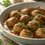 Turkey Meatballs in a bowl with herbs