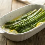 Bright green asparagus with melted butter and lemon drizzle