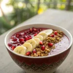 Pomegranate smoothie bowl with fresh fruit toppings