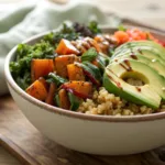 Vegetable grain bowl with grains, roasted vegetables, and avocado