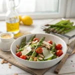 Fresh asparagus salad with cherry tomatoes, Parmesan, and almonds