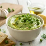 Creamy green pea dip in a bowl