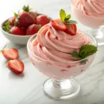 Strawberry frozen yogurt with fresh strawberries in bowl
