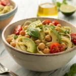 Pasta with avocado, tomatoes, chickpeas, and basil