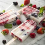 Berry yogurt popsicles with swirls of berries and yogurt