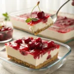 Cherry cheesecake lush dessert with graham crust and cherry topping