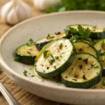 Roasted zucchini with garlic and herbs on a plate