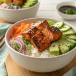Salmon rice bowl with avocado, cucumber, and spicy mayo
