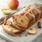 Moist apple fritter bread with cinnamon apples, a buttery crumb, and sweet vanilla glaze.
