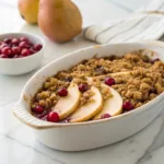 Warm pear cranberry crisp with tender pears, tart cranberries, and a golden buttery oat crumble topping.