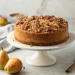 Moist pear coffee cake topped with cinnamon pecan streusel and tender pear slices.